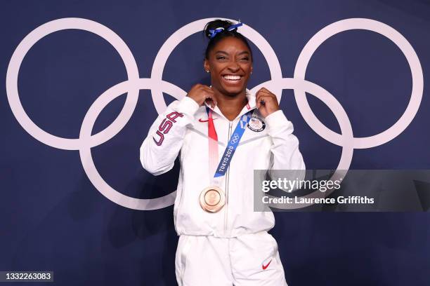 Simone Biles of Team United States poses with the bronze medal following the Women's Balance Beam Final on day eleven of the Tokyo 2020 Olympic Games...