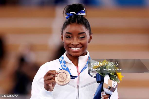 Simone Biles of Team United States poses with the bronze medal during the Women's Balance Beam Final medal ceremony on day eleven of the Tokyo 2020...