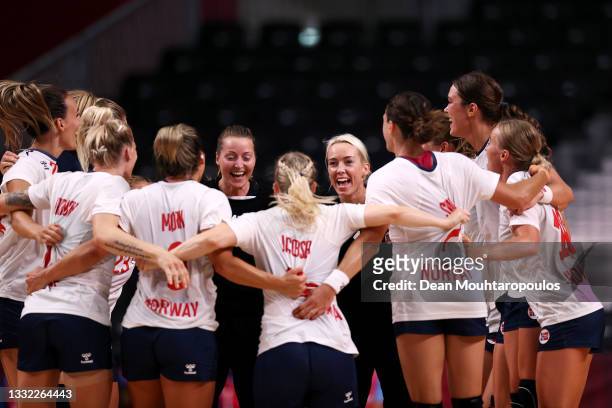 Team Norway goalkeepers Silje Solberg and Katrine Lunde celebrate with teammates after winning the Women's Quarterfinal handball match between Norway...