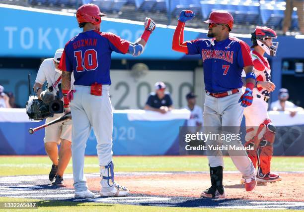 Charlie Valerio of Team Dominican Republic celebrates with Jeison Guzman afer hitting a solo home run in the ninth inning against Team United States...