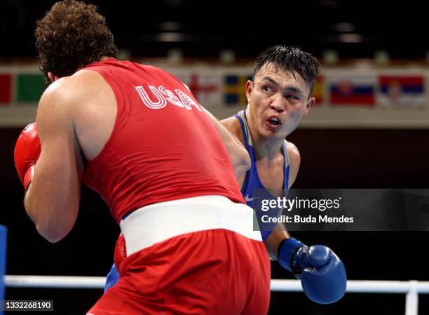 Richard Torrez Junior of Team United States exchanges punches with Kamshybek Kunkabayav of Team Kazakhstan during the Men's Super Heavy semi final on...
