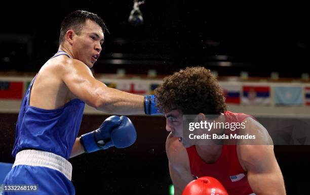 Richard Torrez Junior of Team United States exchanges punches with Kamshybek Kunkabayav of Team Kazakhstan during the Men's Super Heavy semi final on...