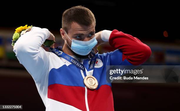 Men’s Light Heavy bronze medalist Imam Khataev of Team Russian Olympic Committee poses with the medal during the Victory Ceremony on day twelve of...