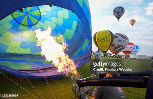 Hot air balloons take to the sky on August 04, 2021 in Bristol, England. "Fiesta Fortnight" takes place until Sunday 15th August 2021 with hundreds...