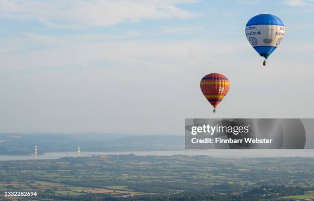 Hot air balloons take to the sky on August 04, 2021 in Bristol, England. "Fiesta Fortnight" takes place until Sunday 15th August 2021 with hundreds...