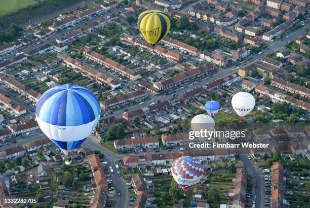 Hot air balloons take to the sky on August 04, 2021 in Bristol, England. "Fiesta Fortnight" takes place until Sunday 15th August 2021 with hundreds...