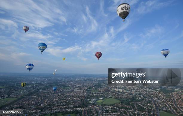 Hot air balloons take to the sky on August 04, 2021 in Bristol, England. "Fiesta Fortnight" takes place until Sunday 15th August 2021 with hundreds...