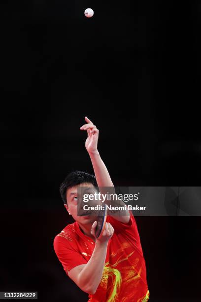 Ma Long of Team China serves the ball during his Men's Team Semifinals table tennis match on day twelve of the Tokyo 2020 Olympic Games at Tokyo...