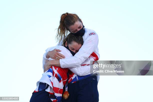 Hannah Mills and Eilidh McIntyre of Team Great Britain pose with their gold medals for winning the Women's 470 class on day twelve of the Tokyo 2020...