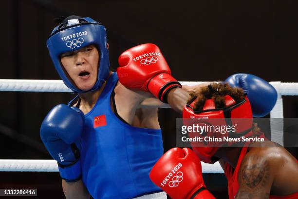 Oshae Jones of Team United States exchanges punches with Gu Hong of Team China during the Women's Welter Semifinal on day twelve of the Tokyo 2020...