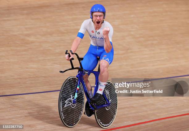 Simone Consonni of Team Italy celebrates winning a gold medal during the Men's team pursuit finals, gold medal of the track cycling on day twelve of...