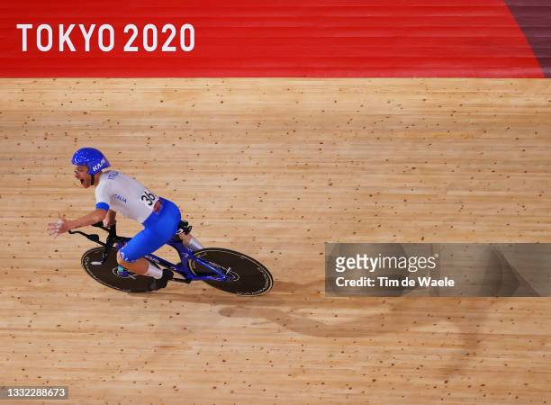 Simone Consonni of Team Italy celebrates winning a gold medal after setting a new World record during the Men's team pursuit finals, gold medal of...