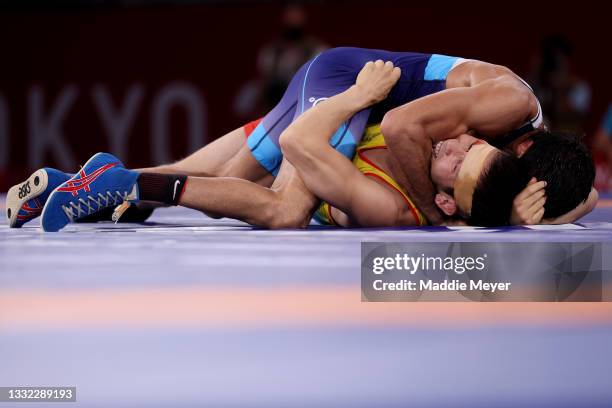 Nurislam Sanayev of Team Kazakhstan competes against Kumar Ravi of Team India during the Men’s Freestyle 57kg Semi Final on day twelve of the Tokyo...