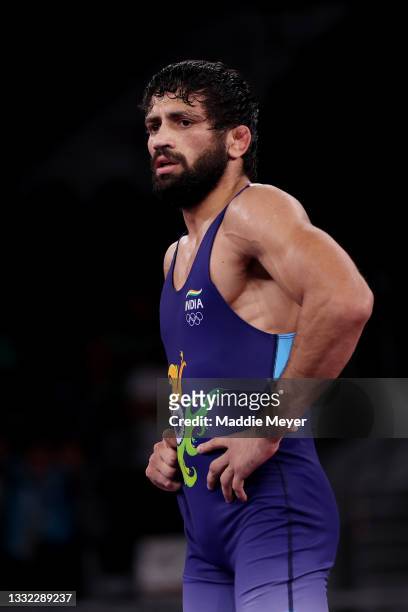 Kumar Ravi of Team India reacts after being defeated by Nurislam Sanayev of Team Kazakhstan during the Men’s Freestyle 57kg Semi Final on day twelve...