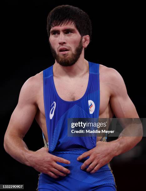 Zavur Uguev of Team ROC looks on against Reza Atrinagharchi of Team Islamic Republic of Iran during the Men’s Freestyle 57kg Semi Final on day twelve...