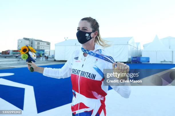 Eilidh McIntyre of Team Great Britain celebrates with gold following the Women's 470 class medal race on day twelve of the Tokyo 2020 Olympic Games...