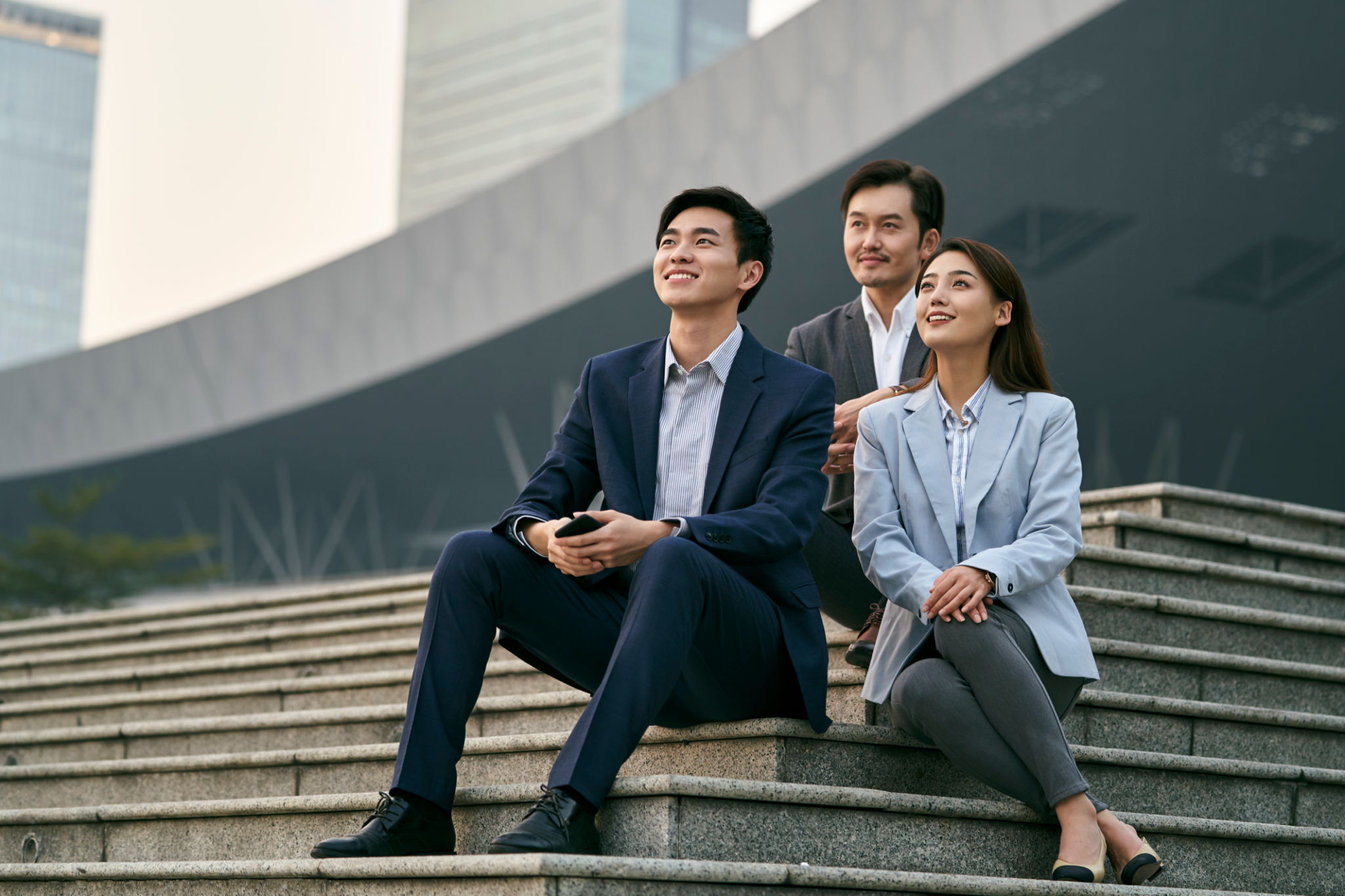 asian business people relaxing outdoors asian business people relaxing outdoors
