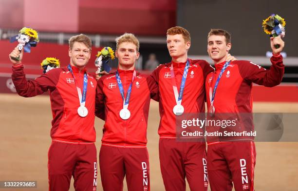 Silver medalist Lasse Norman Hansen, Niklas Larsen, Frederik Madsen and Rasmus Pedersen of Team Denmark, pose on the podium during the medal ceremony...