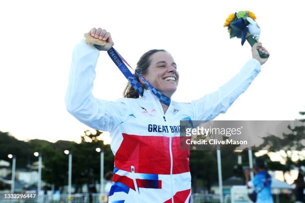 Hannah Mills of Team Great Britain celebrates with her gold medal following the Women's 470 class medal race on day twelve of the Tokyo 2020 Olympic...