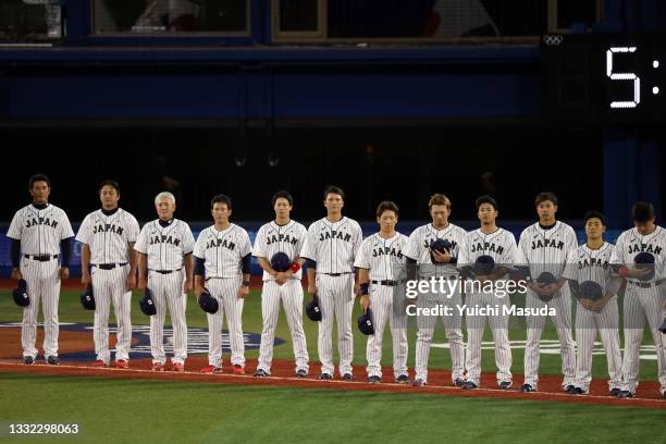 Team Japan stands for the national anthem before the game against Team Republic of Korea during the semifinals of men's baseball on day twelve of the...