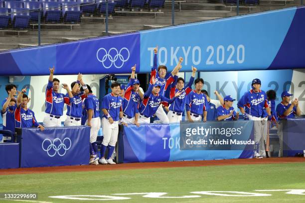 The Team Republic of Korea dugout reacts in the first inning against Team Japan during the semifinals of men's baseball on day twelve of the Tokyo...