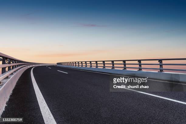 viaduct at dusk - multiple lane highway ストックフォトと画像