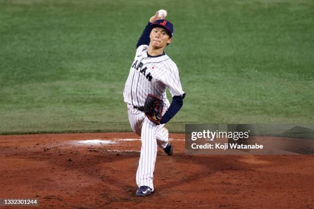 Yoshinobu Yamamoto of Team Japan pitches in the second inning against Team Republic of Korea during the semifinals of men's baseball on day twelve of...