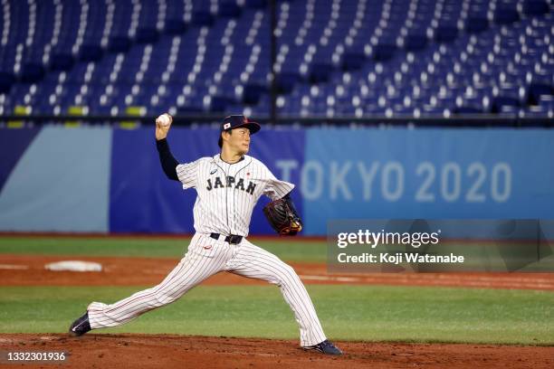 Yoshinobu Yamamoto of Team Japan pitches in the third inning against Team Republic of Korea during the semifinals of men's baseball on day twelve of...