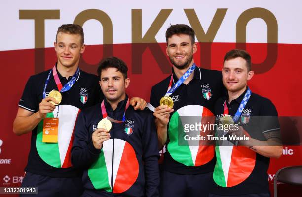 Gold medalists Jonathan Milan, Francesco Lamon, Filippo Ganna and Simone Consonni of Team Italy, pose for a photograph on the media press conference...