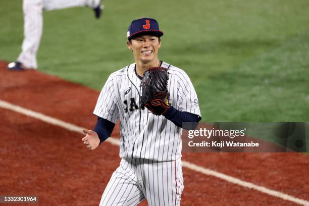 Yoshinobu Yamamoto of Team Japan reacts as he walks back to the dugout against Team Republic of Korea during the semifinals of men's baseball on day...