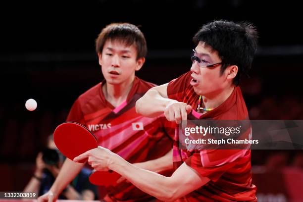 Koki Niwa and Mizutani Jun of Team Japan in action during their Men's Team Semifinals table tennis match on day twelve of the Tokyo 2020 Olympic...