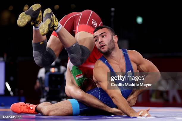 Mohammadreza Geraei of Team Iran competes against Parviz Nasibov of Team Ukraine during the Men’s Greco-Roman 67kg Gold Medal Match on day twelve of...