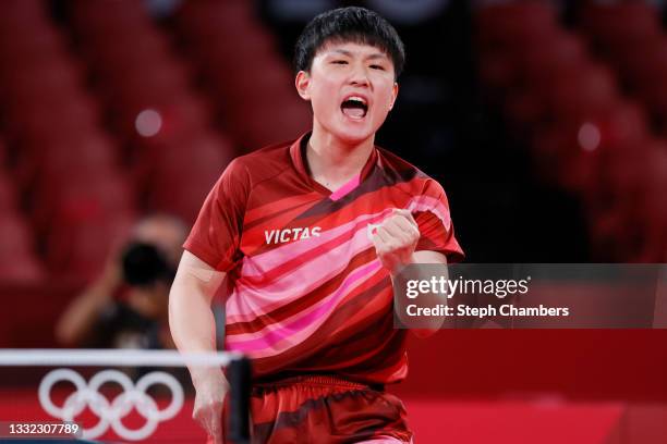 Harimoto Tomokazu of Team Japan reacts during his Men's Team Semifinals table tennis match on day twelve of the Tokyo 2020 Olympic Games at Tokyo...