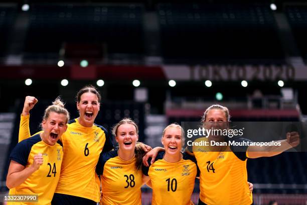 Nathalie Hagman, Carin Stromberg, Elin Hansson, Mathilda Lundstrom and Johanna Westberg of Team Sweden pose after winning the Women's Quarterfinal...