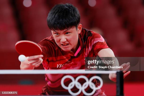 Harimoto Tomokazu of Team Japan in action during his Men's Team Semifinals table tennis match on day twelve of the Tokyo 2020 Olympic Games at Tokyo...