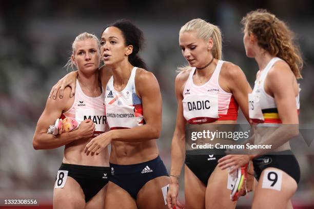 Katarina Johnson-Thompson of Team Great Britain is consoled by Verena Mayr of Team Austria as she walks off the track injured during the Women's...