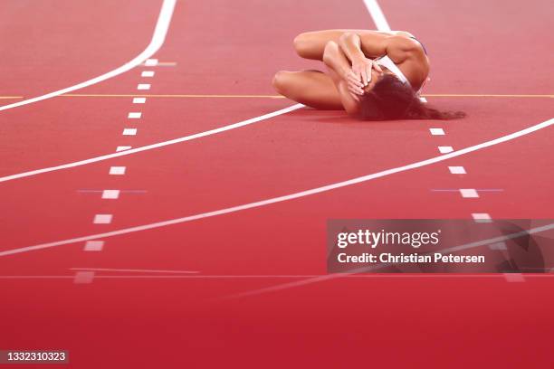 Katarina Johnson-Thompson of Team Great Britain sustains an injury in the Women's Heptathlon 200m on day twelve of the Tokyo 2020 Olympic Games at...