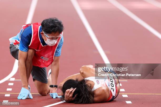 Katarina Johnson-Thompson of Team Great Britain sustains an injury in the Women's Heptathlon 200m on day twelve of the Tokyo 2020 Olympic Games at...