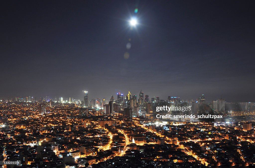 Full moon over Makati skyline