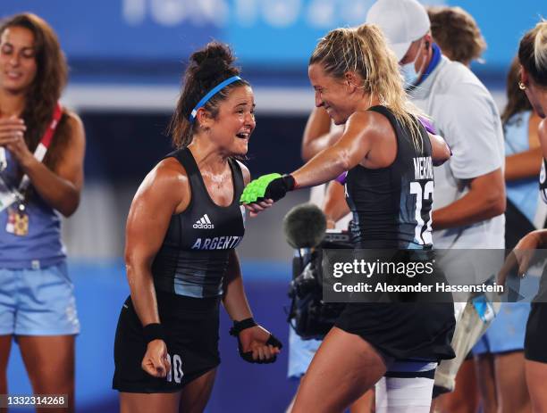 Maria Jose Granatto and Delfina Merino of Team Argentina celebrate victory in the Women's Semifinal match between Argentina and India on day twelve...