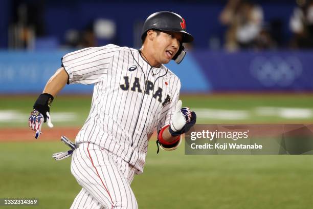 Tetsuto Yamada of Team Japan runs to first base in the fifth inning against Team Republic of Korea during the semifinals of men's baseball on day...