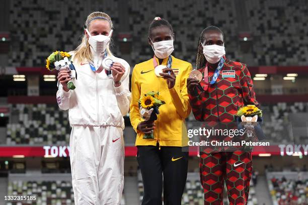 Silver medalist Courtney Frerichs of Team United States, gold medalist Peruth Chemutai of Team Uganda and bronze medalist Hyvin Kiyeng of Team Kenya...