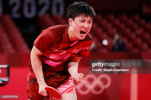 Harimoto Tomokazu of Team Japan reacts during his Men's Team Semifinals table tennis match on day twelve of the Tokyo 2020 Olympic Games at Tokyo...