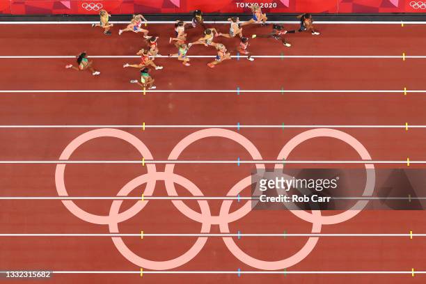The athletes run past the on track olympic rings during the Women's 3000m Steeplechase Final on day twelve of the Tokyo 2020 Olympic Games at Olympic...
