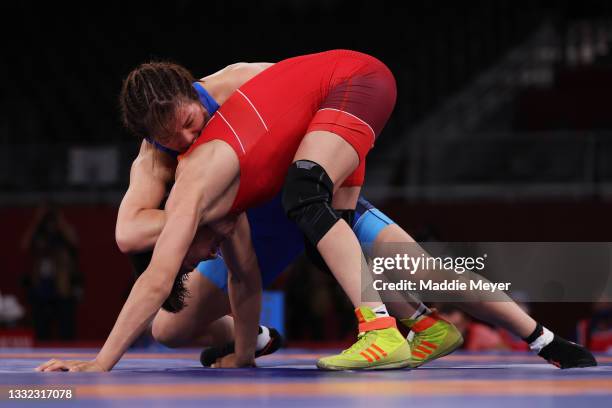 Yukako Kawai of Team Japan competes against Aisuluu Tynybekova of Team Kyrgyzstan during the Women’s Freestyle 62kg Gold Medal Match on day twelve of...