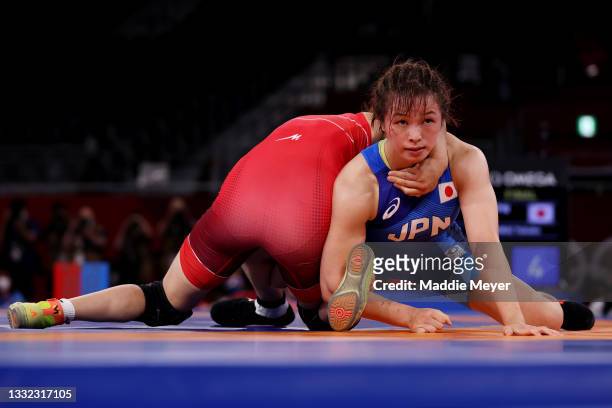 Yukako Kawai of Team Japan competes against Aisuluu Tynybekova of Team Kyrgyzstan during the Women’s Freestyle 62kg Gold Medal Match on day twelve of...
