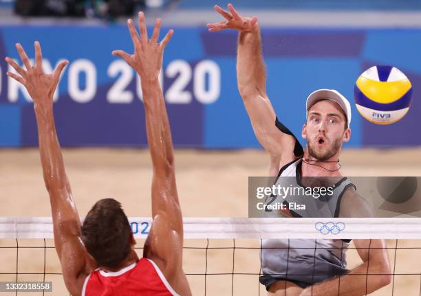 Oleg Stoyanovskiy of Team ROC competes against Clemens Wickler of Team Germany during the Men's Quarterfinal beach volleyball on day twelve of the...