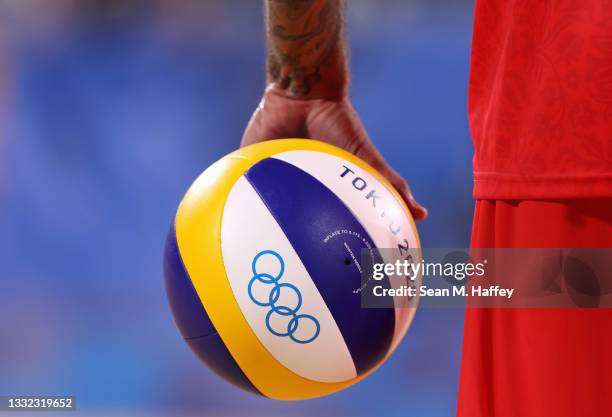 Viacheslav Krasilnikov of Team ROC prepares to serve against Team Germany during the Men's Quarterfinal beach volleyball on day twelve of the Tokyo...