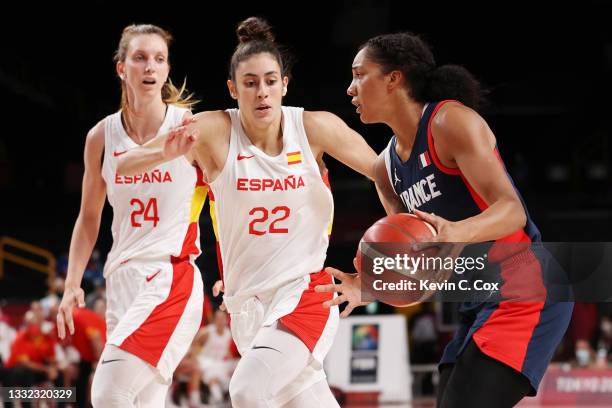 Gabrielle Williams of Team France brings the ball up court against Maria Conde and Laura Gil of Team Spain during the first half of a Women's...