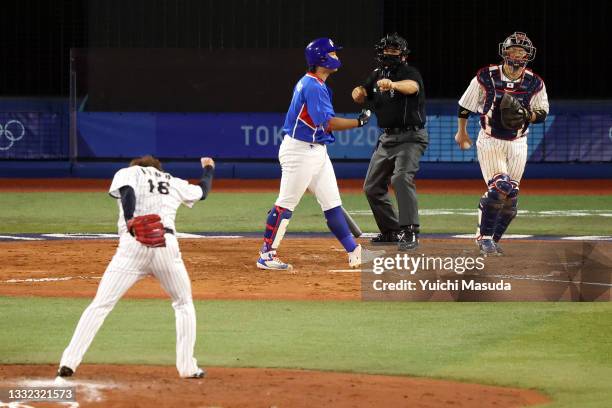 Hiromi Itoh of Team Japan reacts after striking out Baekho Kang of Team South Korea in the seventh inning during the semifinals of men's baseball on...